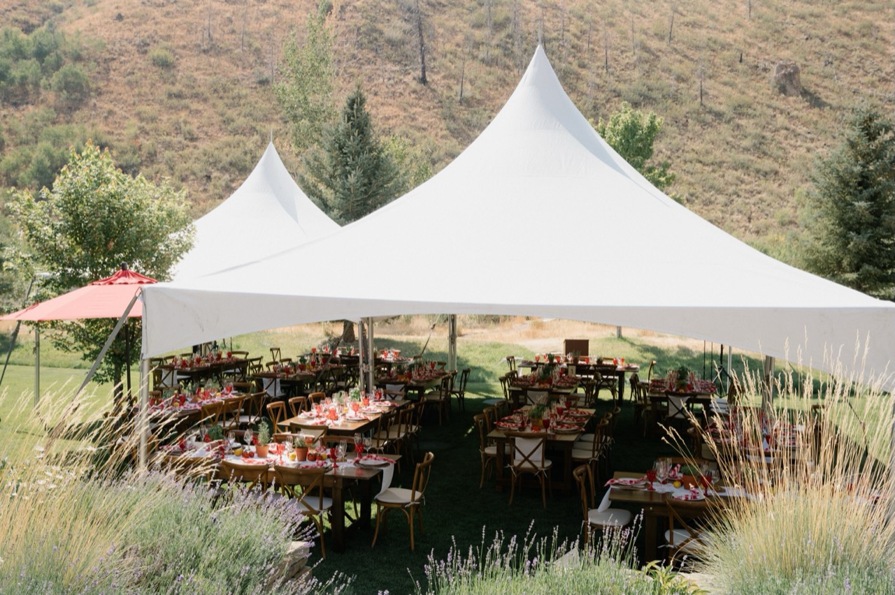 An outdoor dinner under the tents on a Sun Valley lawn