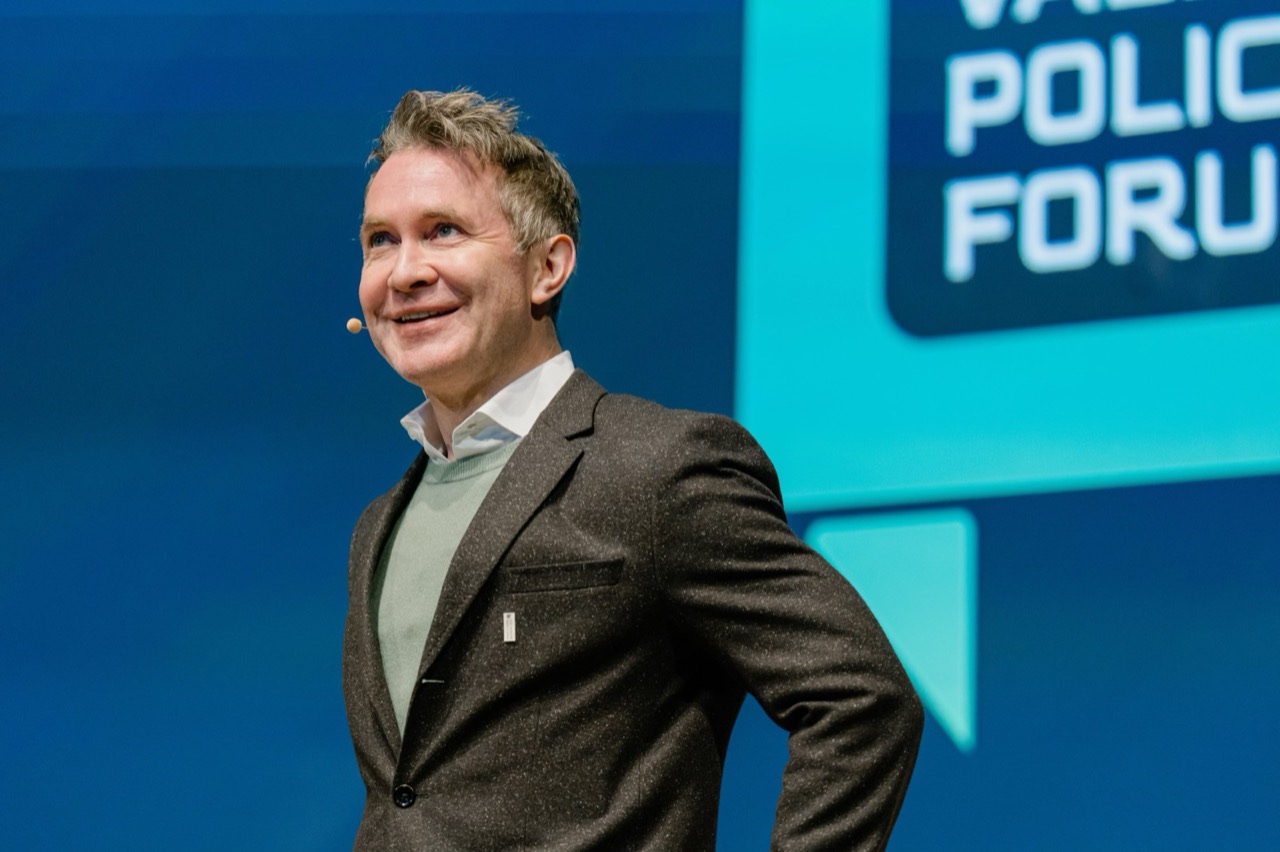 A speaker on stage at the Sun Valley Policy Forum